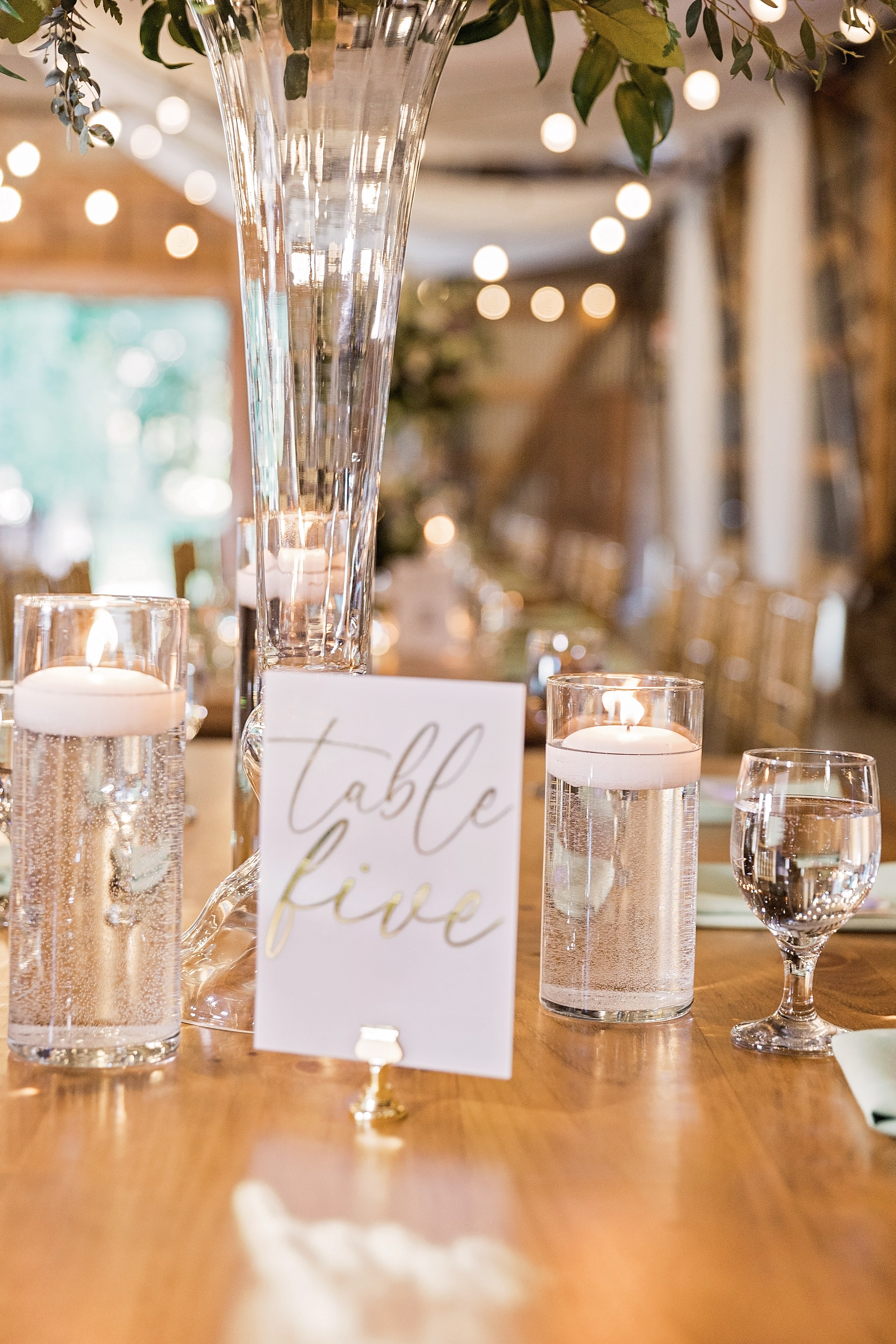 Trio of cylinders with floater candles.